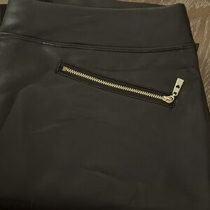 NWOT faux leather pant in front and stretchy fabric in back.
